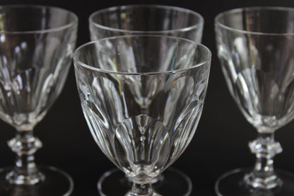 Clear, crystal Claret glasses on black background.