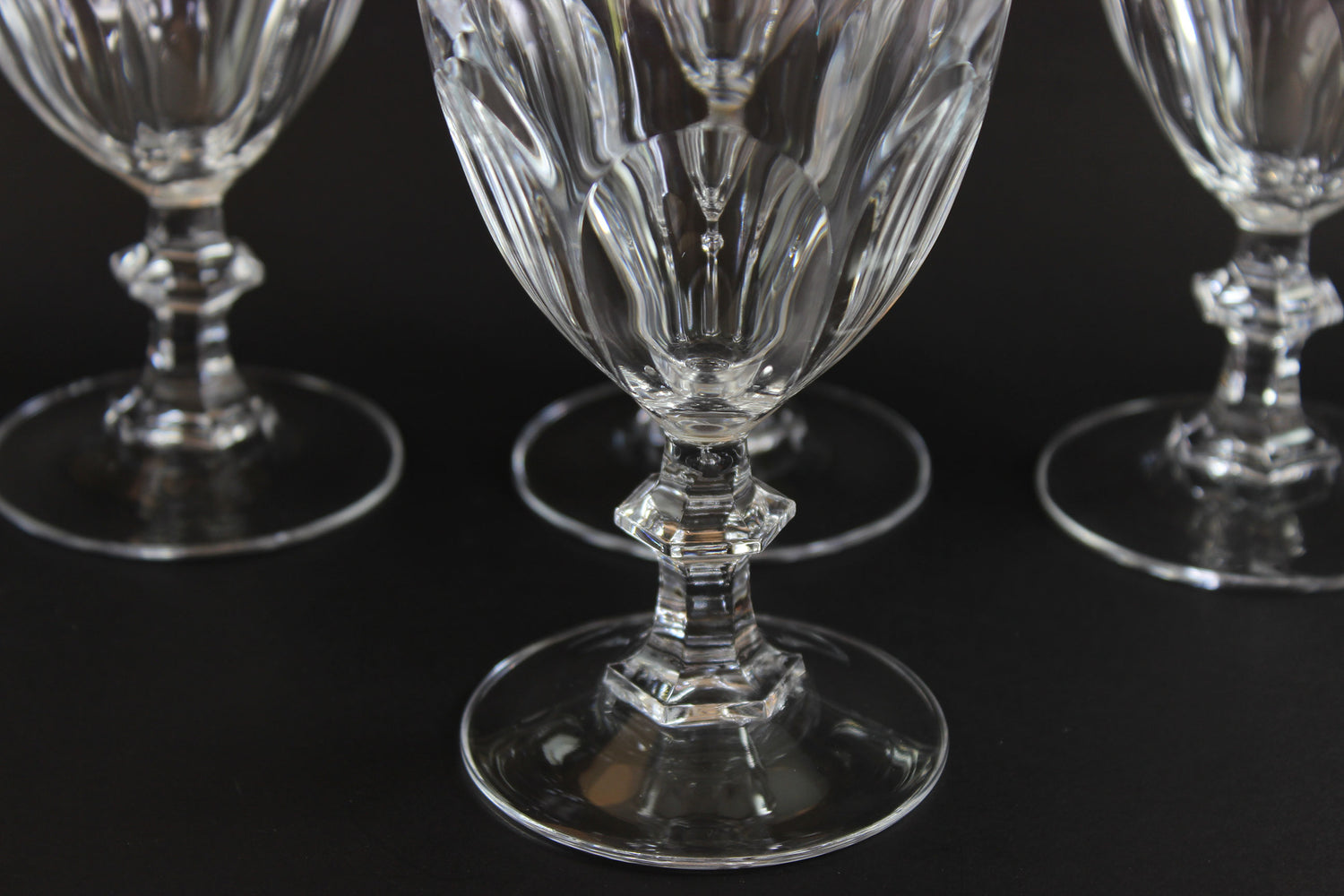 Clear, crystal Claret glasses on black background.