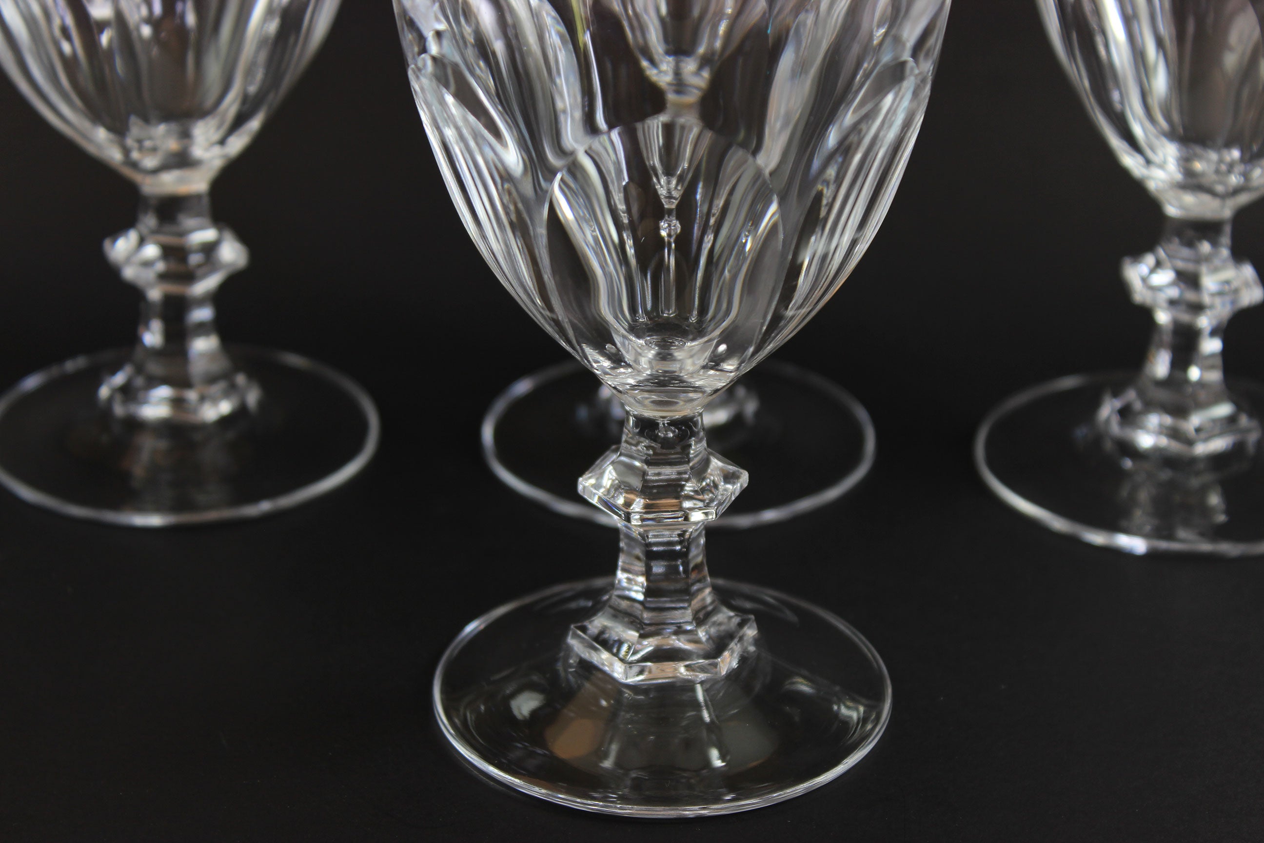 Clear, crystal Claret glasses on black background.