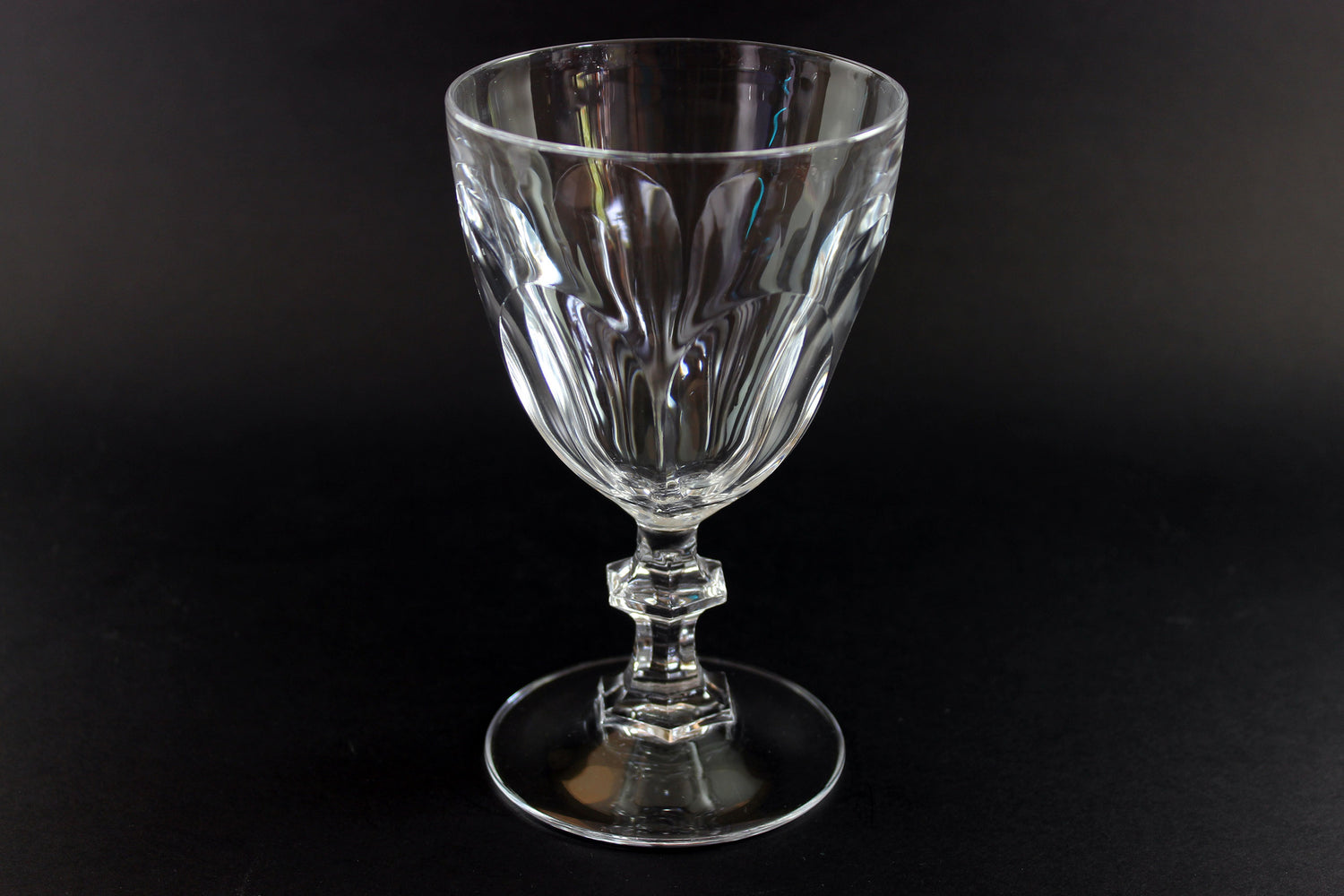 Clear crystal goblet on a black background