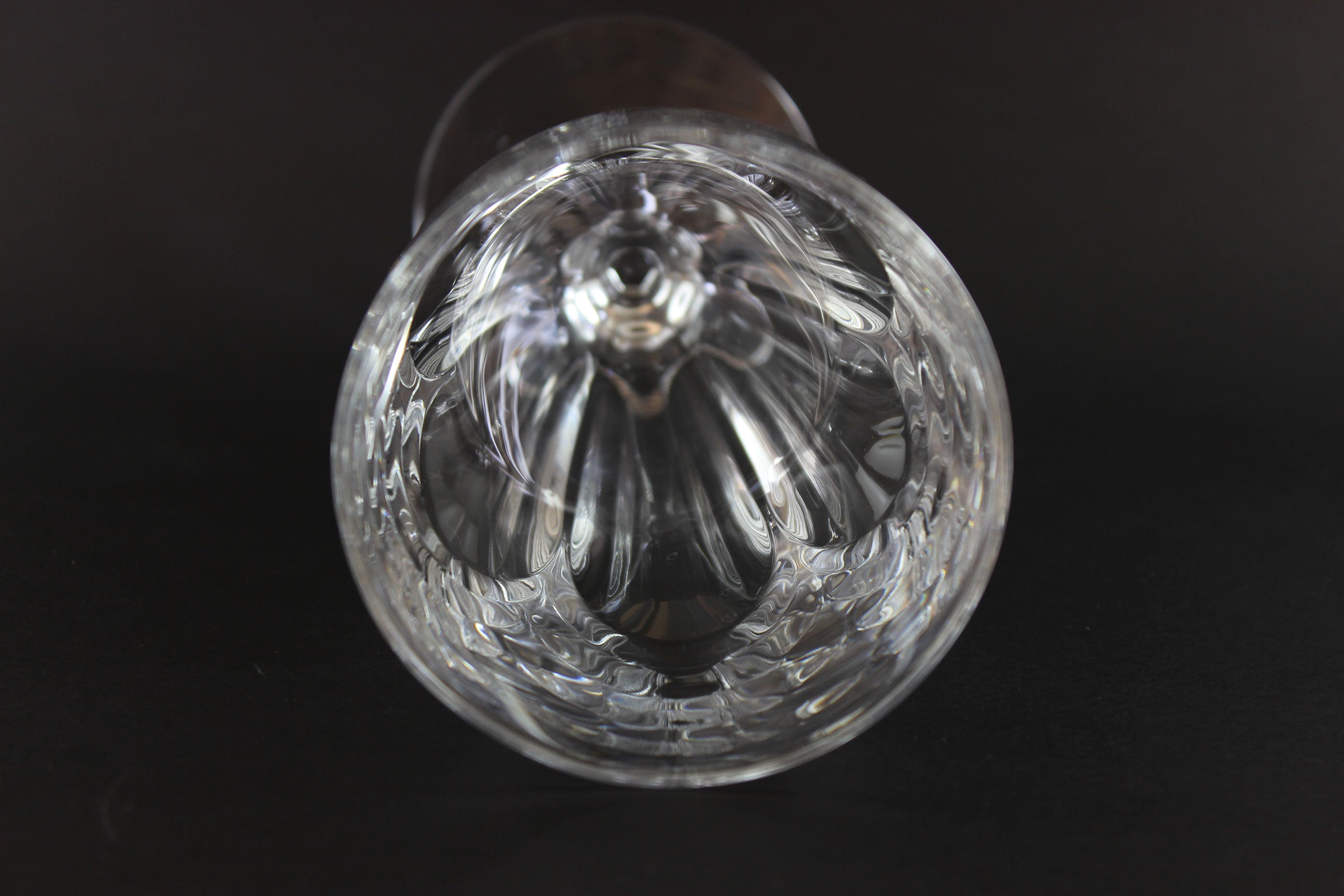 Clear crystal goblet on a black background