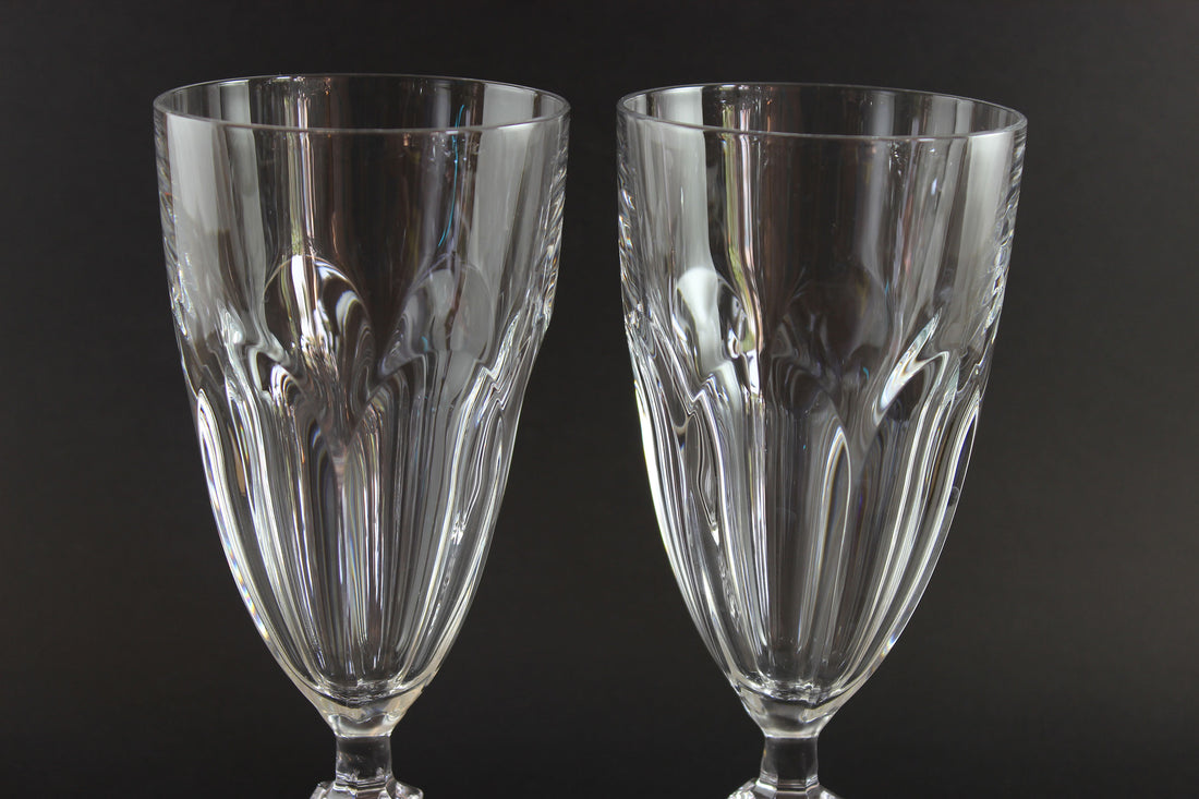 Two clear crystal goblets on a black background