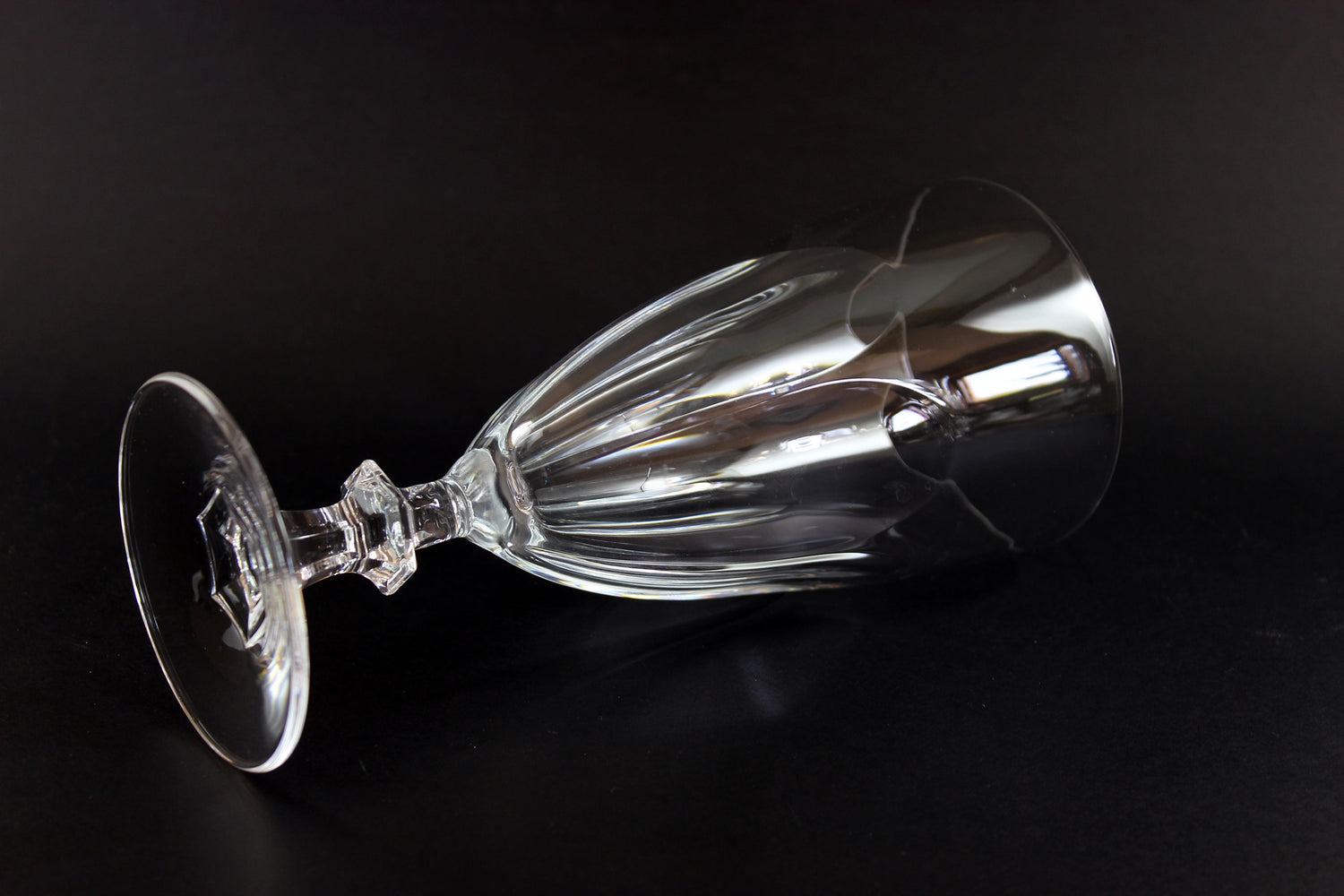 Clear crystal goblet on a black background