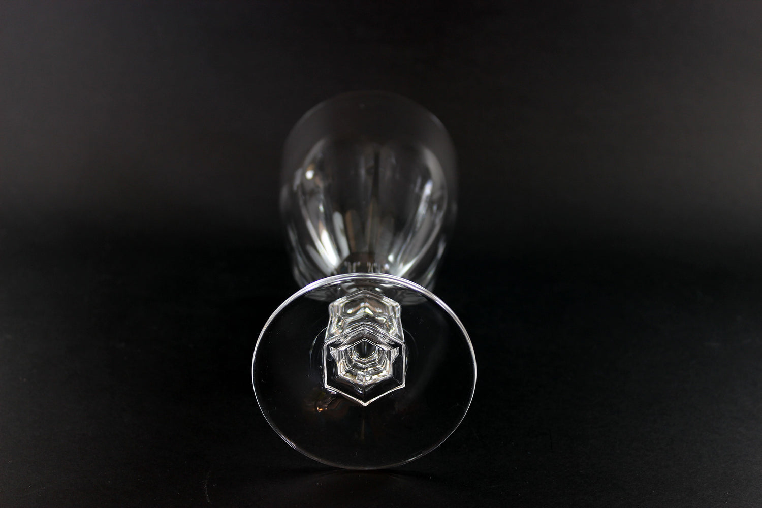 Clear crystal goblet on a black background
