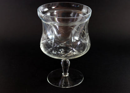 Clear glass goblet on a black background