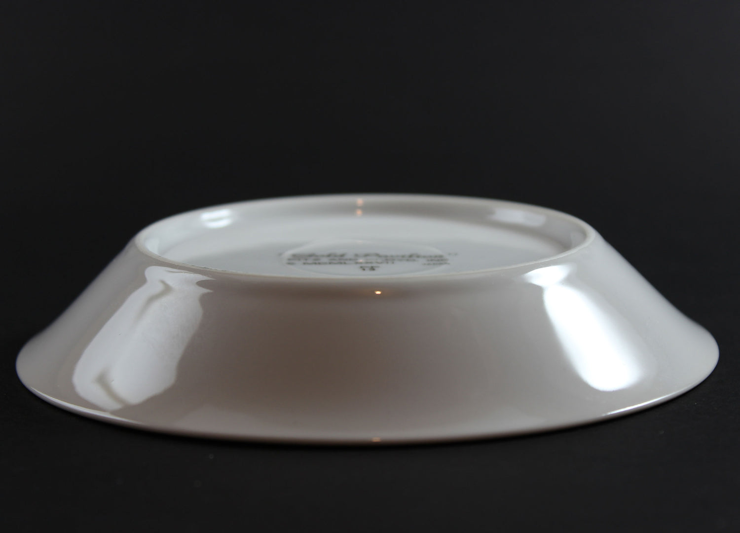 White ceramic bowl on a black background