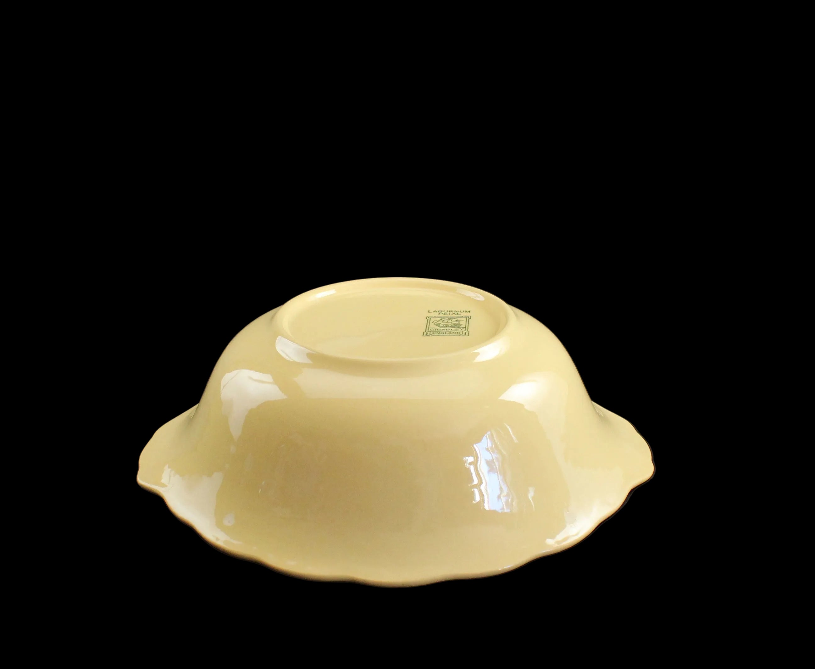 Yellow ceramic bowl on a black background