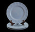 Set of light blue ceramic plates on a black background
