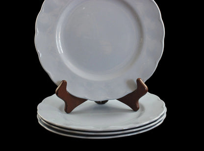 Set of light blue ceramic plates on a black background