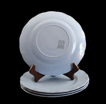 Set of light blue ceramic plates on a black background