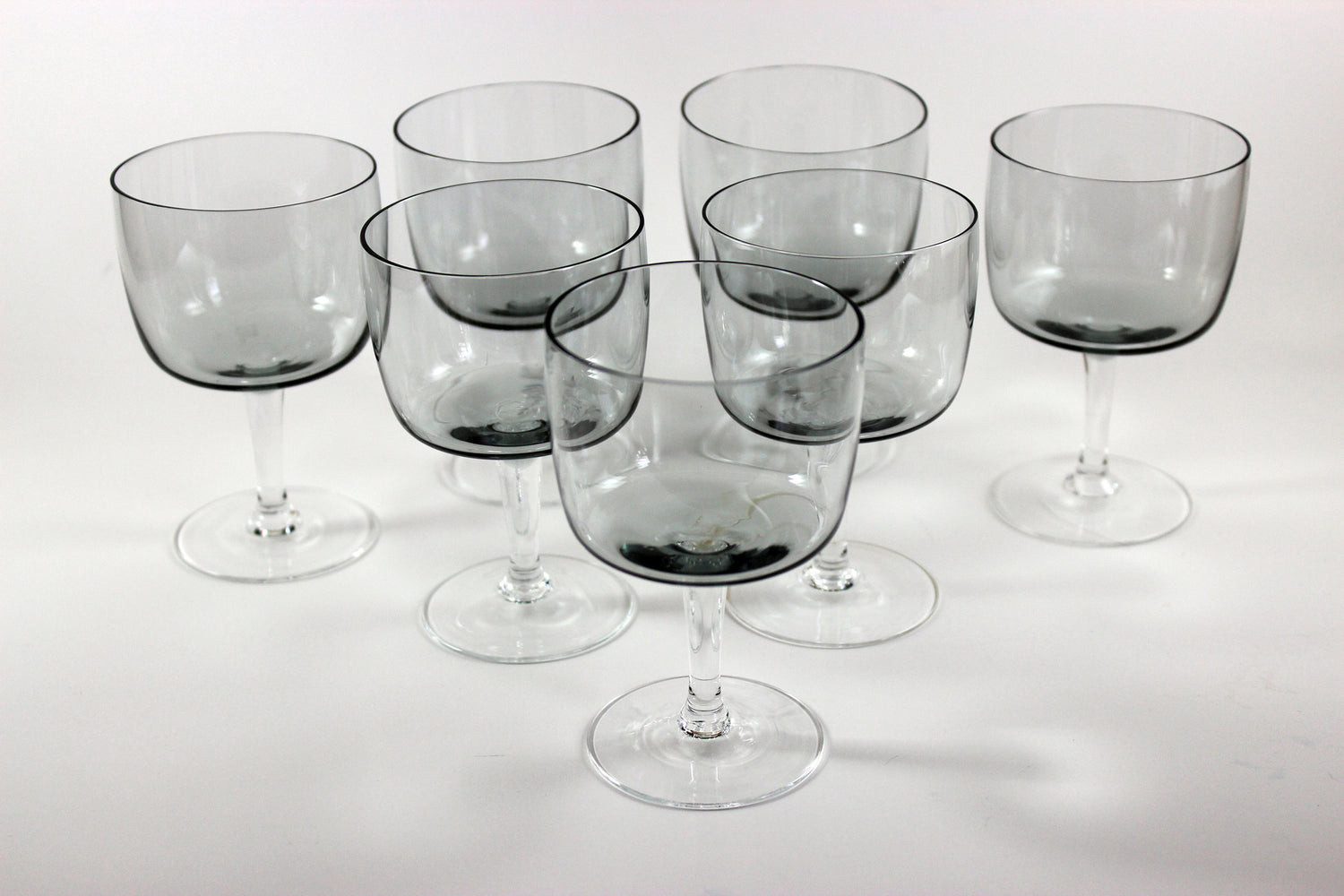 Set of smoked glass port glasses on a white background