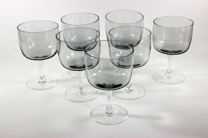 Set of smoked glass port glasses on a white background