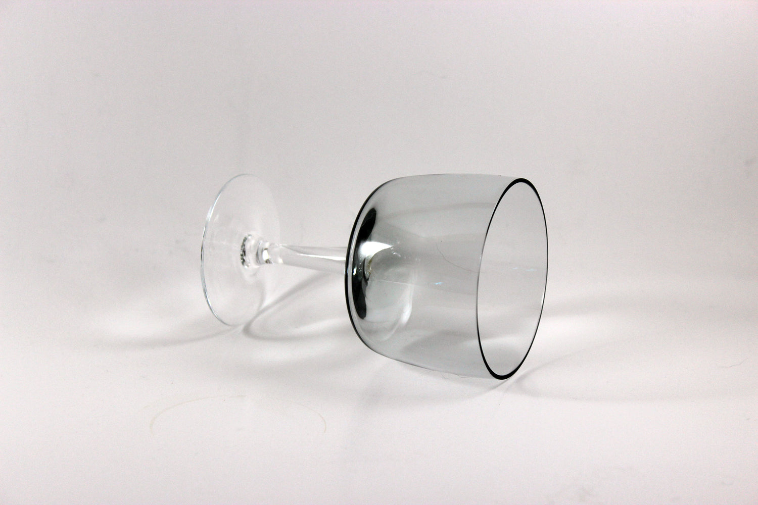 Set of smoked glass port glasses on a white background