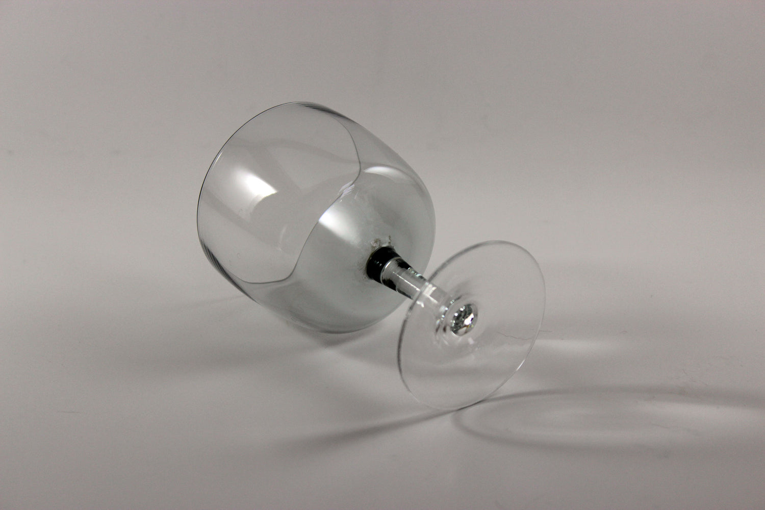 Set of smoked glass port glasses on a white background