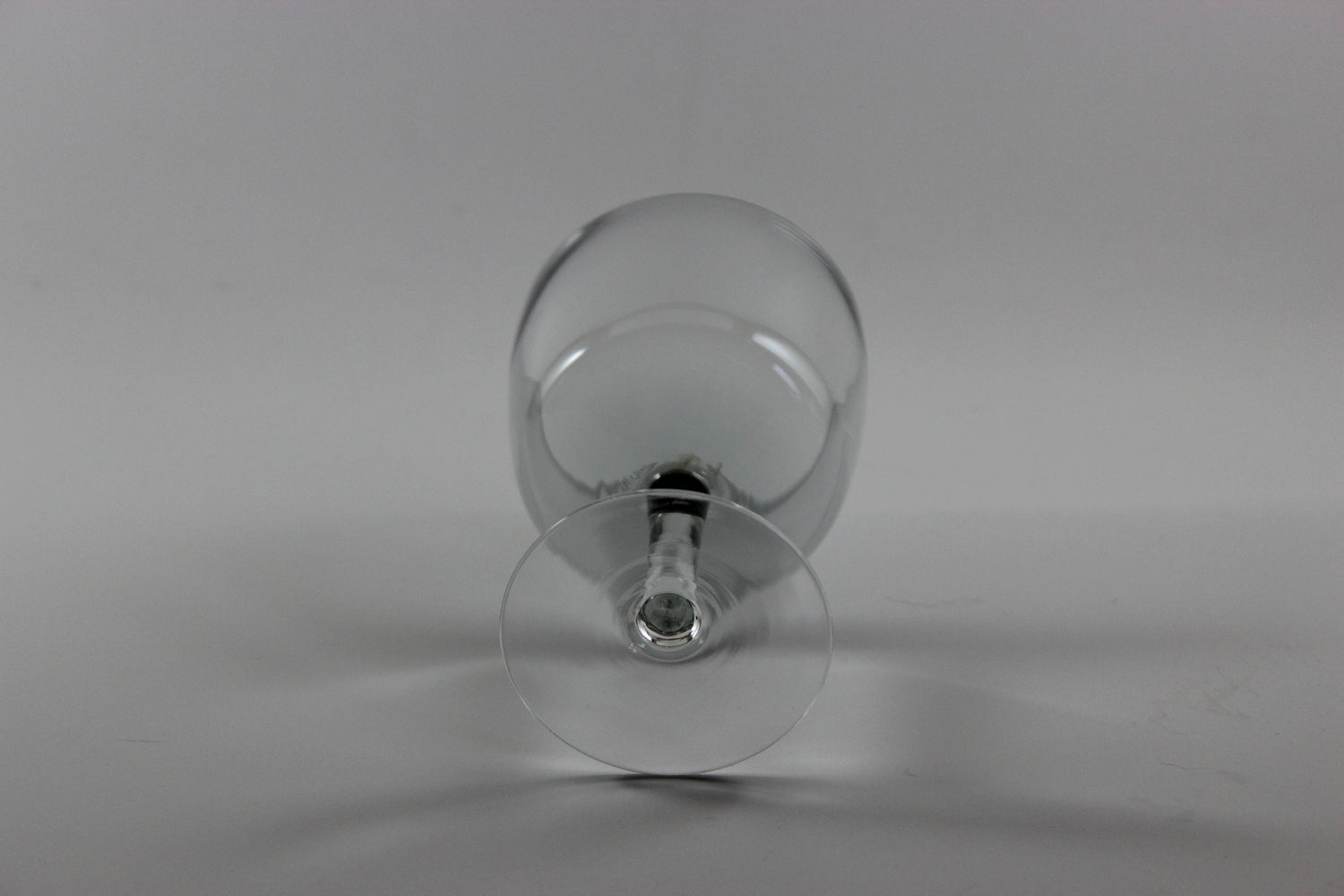 Set of smoked glass port glasses on a white background