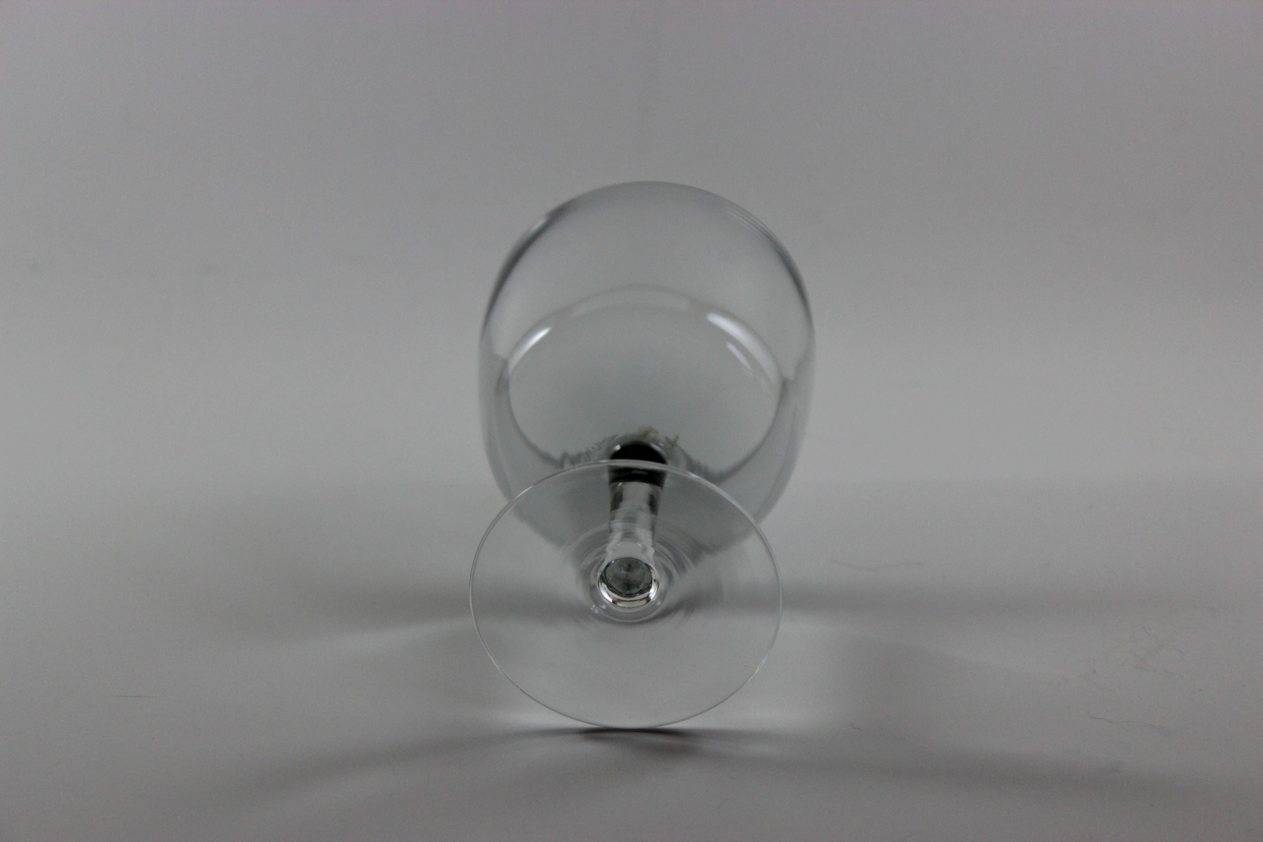 Set of smoked glass port glasses on a white background