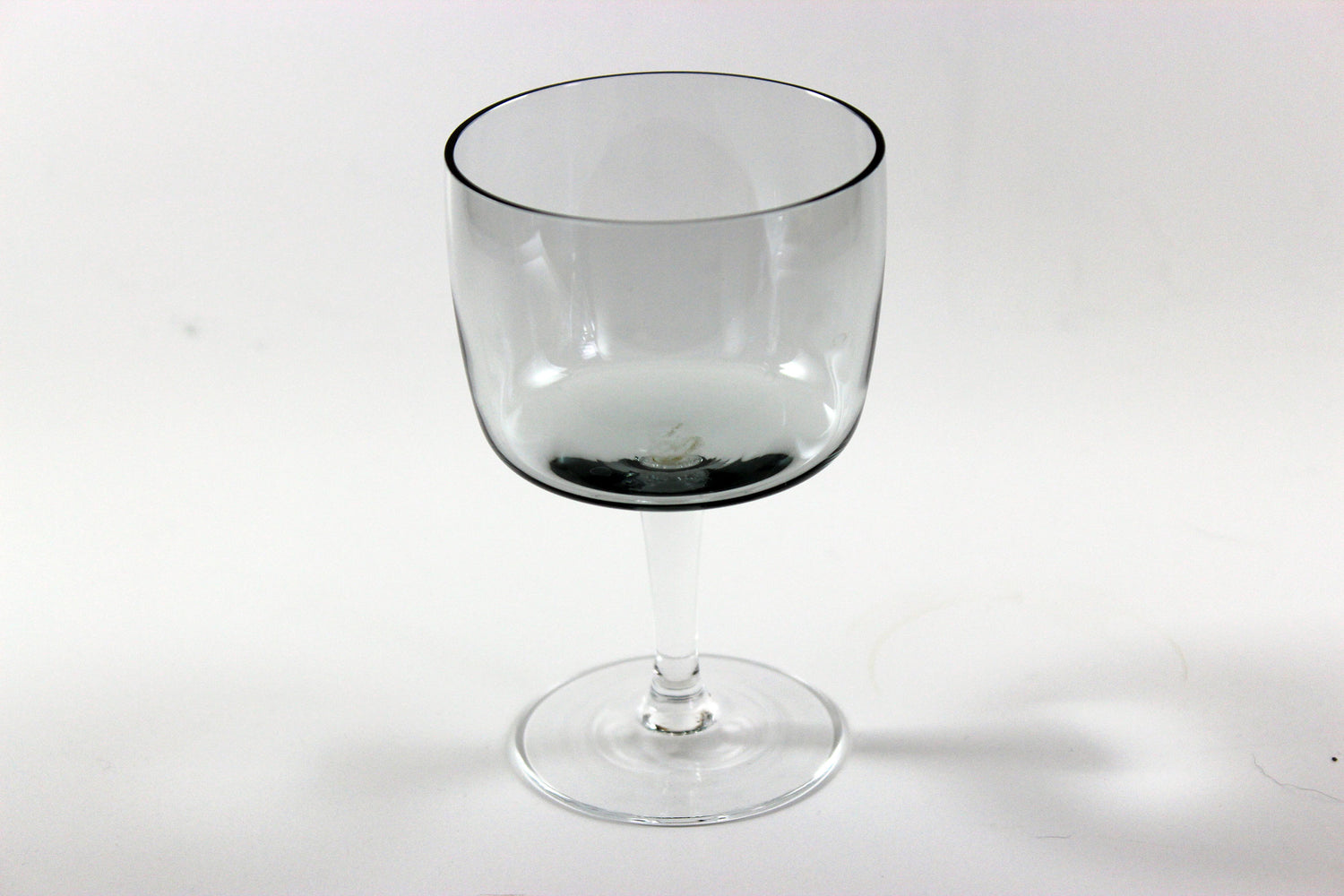 Set of smoked glass port glasses on a white background