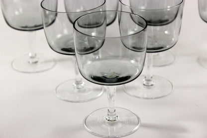 Set of smoked glass port glasses on a white background