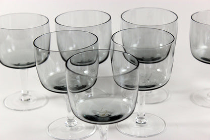 Set of smoked glass port glasses on a white background