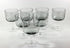 Set of smoked glass wine glasses on a white background
