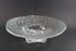 Clear glass bowl with textured design on a dark background