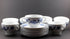 Set of white porcelain soup bowls with blue floral patterns on a gray background
