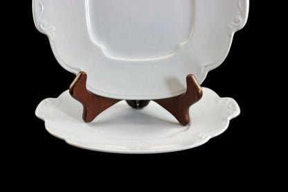 Light blue ceramic cake plate on black background.