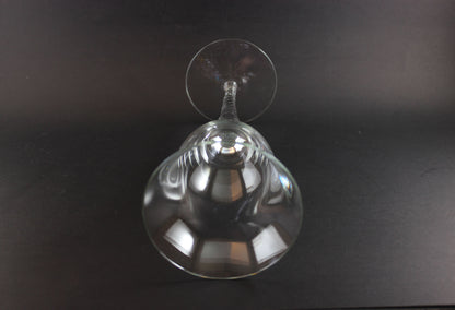 Clear glass wine glass on a black background