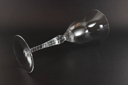 Clear glass wine glass on a black background