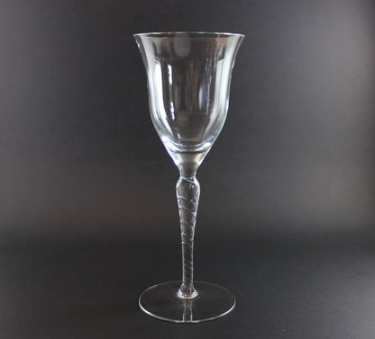 Clear glass wine glass on a black background