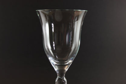 Clear glass goblet on a black background