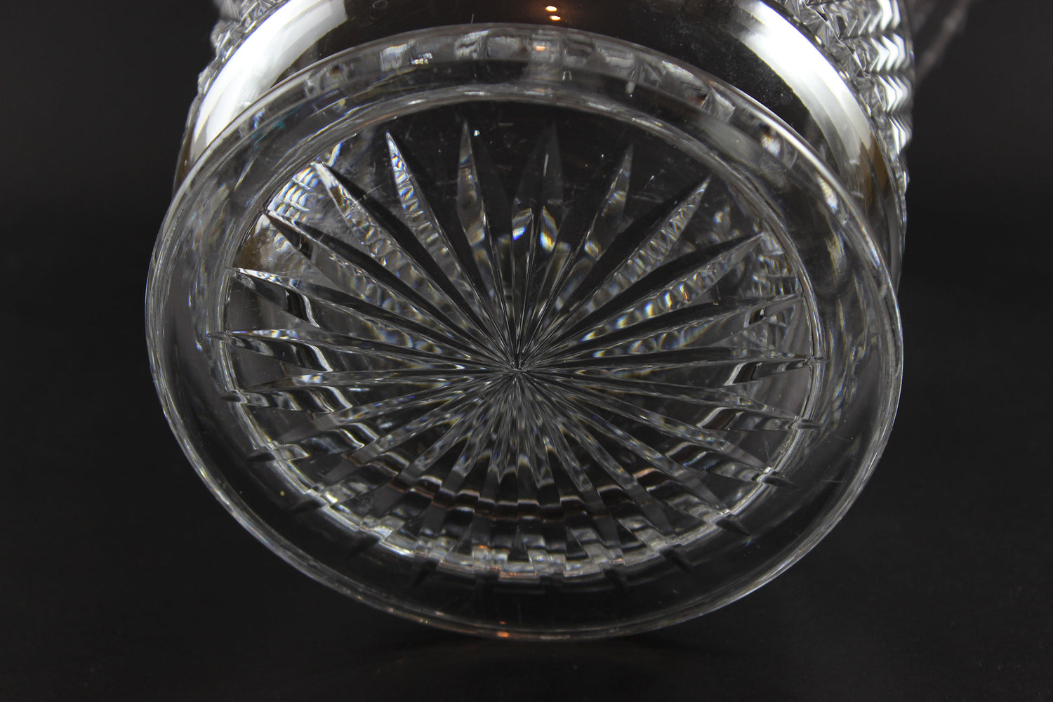Large Crystal vase or bowl with intricate cut patterns on a black background
