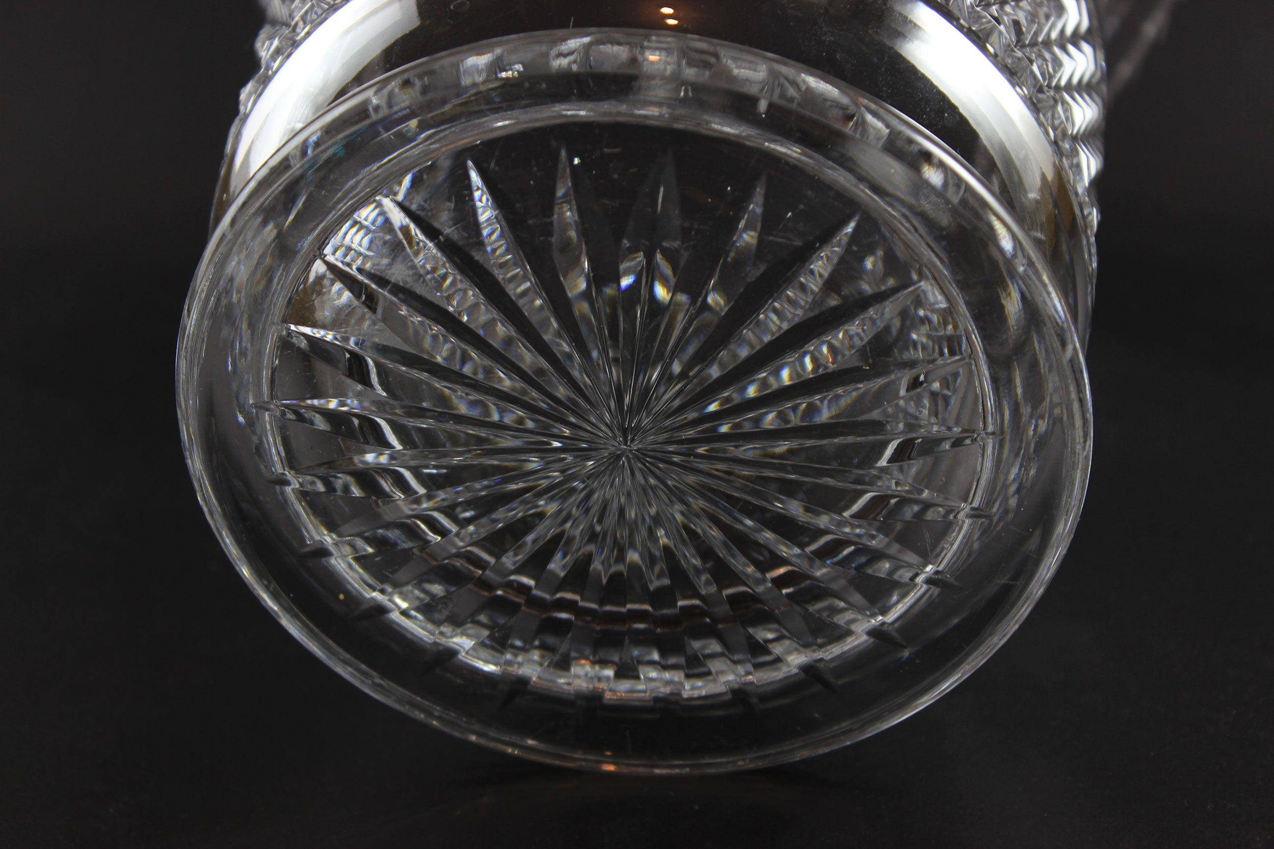 Large Crystal vase or bowl with intricate cut patterns on a black background