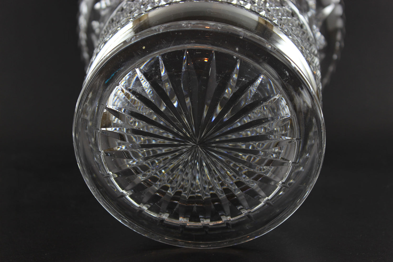Large Crystal vase or bowl with intricate cut patterns on a black background