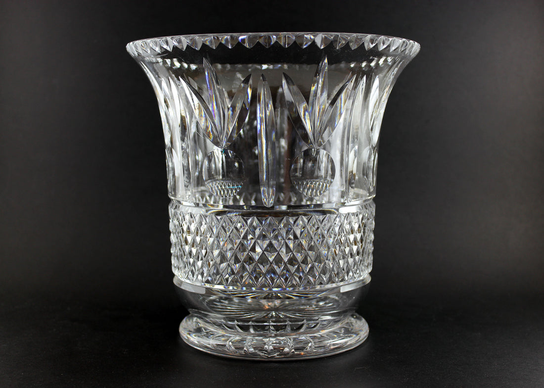 Large Crystal vase or bowl with intricate cut patterns on a black background