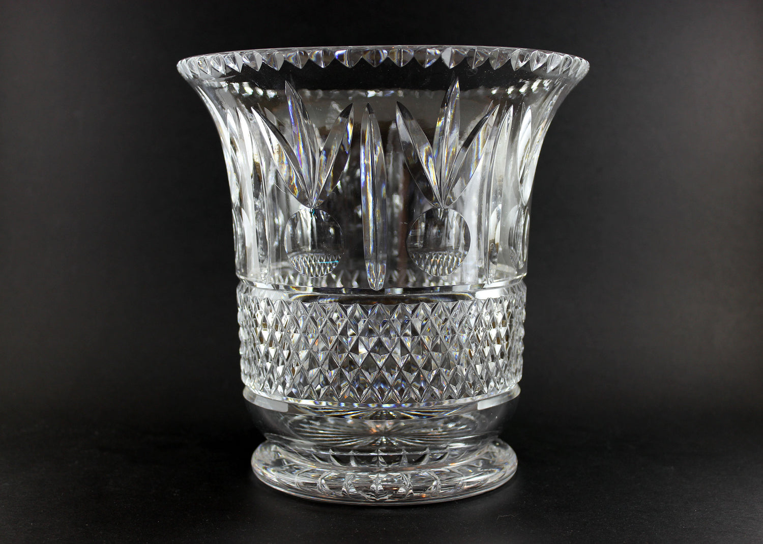 Large Crystal vase or bowl with intricate cut patterns on a black background
