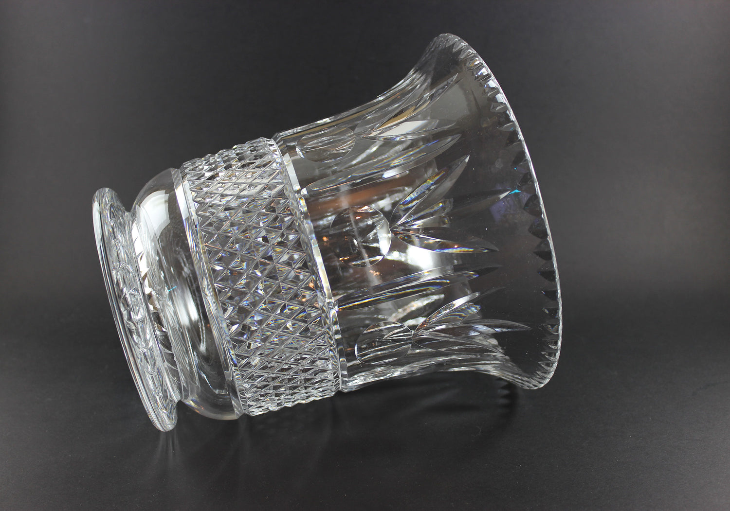 Large Crystal vase or bowl with intricate cut patterns on a black background