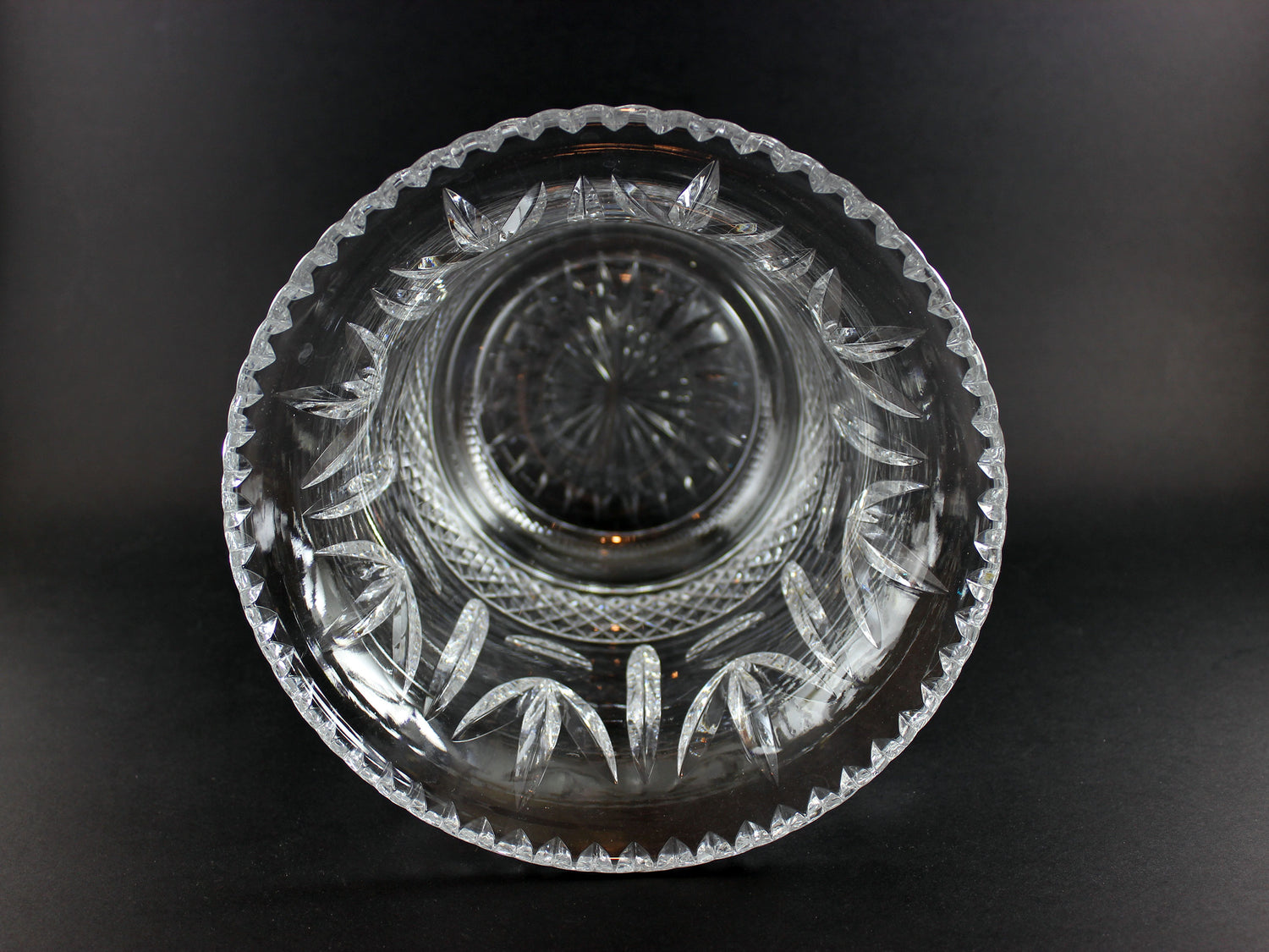 Large Crystal vase or bowl with intricate cut patterns on a black background