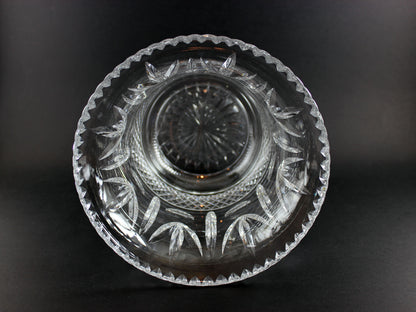 Large Crystal vase or bowl with intricate cut patterns on a black background