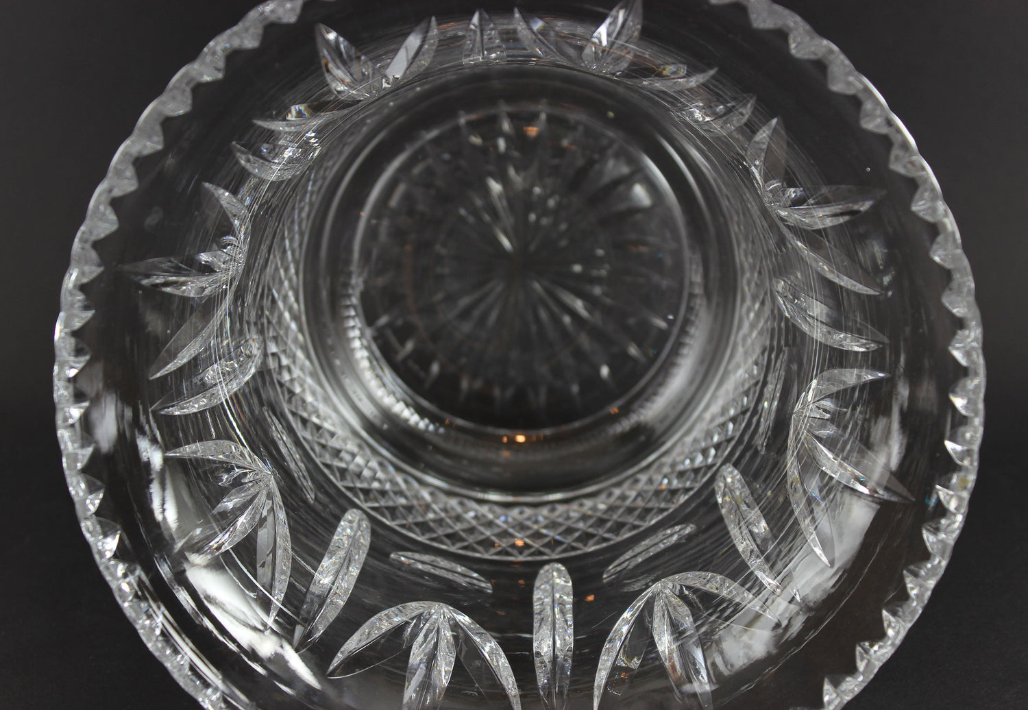 Large Crystal vase or bowl with intricate cut patterns on a black background