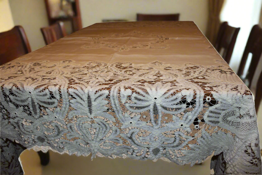 White lace tablecloth on a wooden table with a blurred background