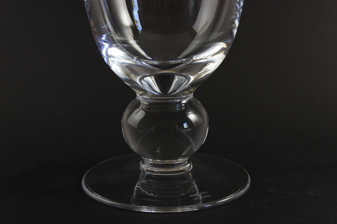 Clear Waterford crystal vase on a black background