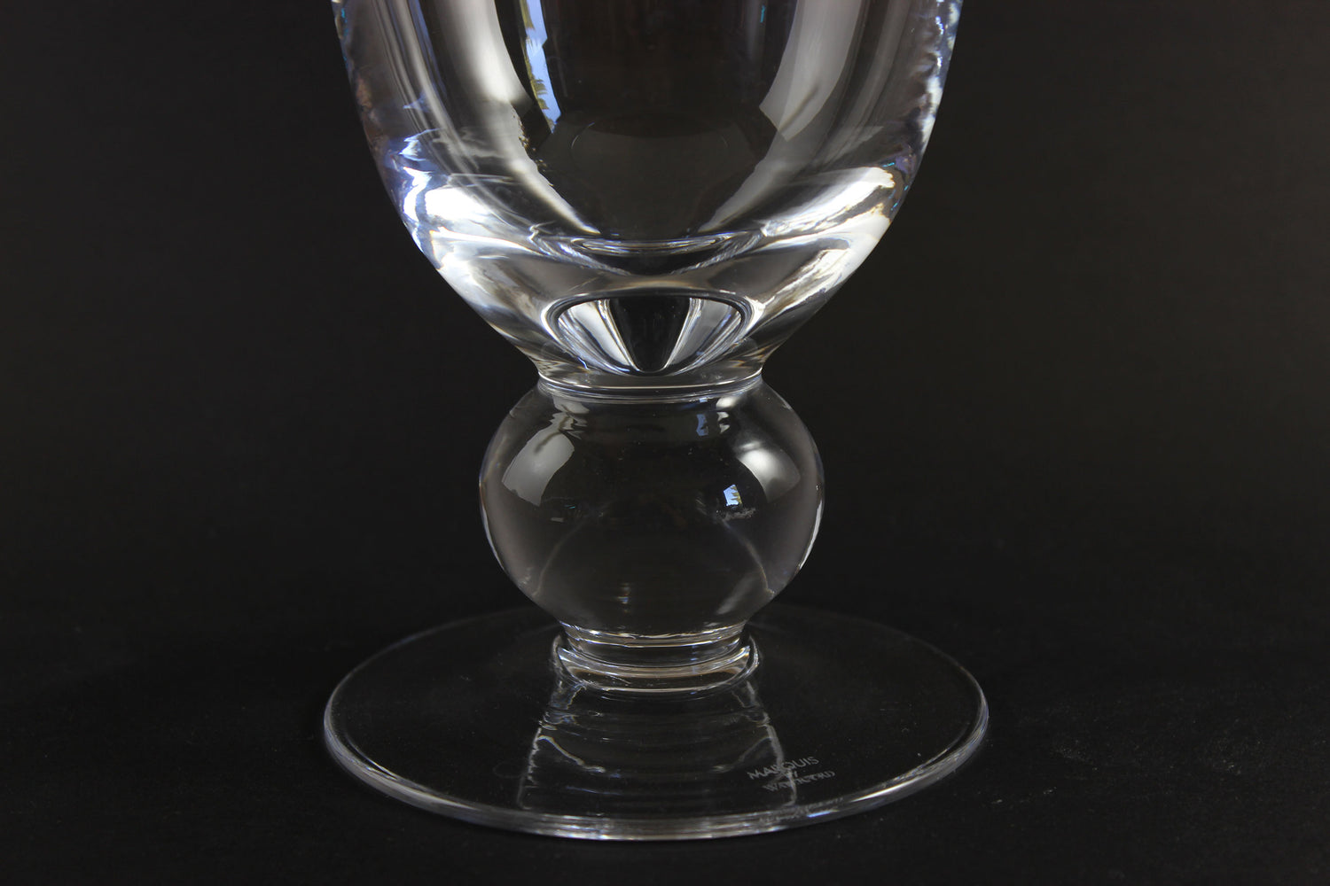 Clear Waterford crystal vase on a black background