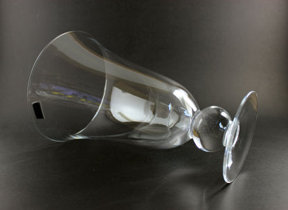Clear Waterford crystal vase on a black background