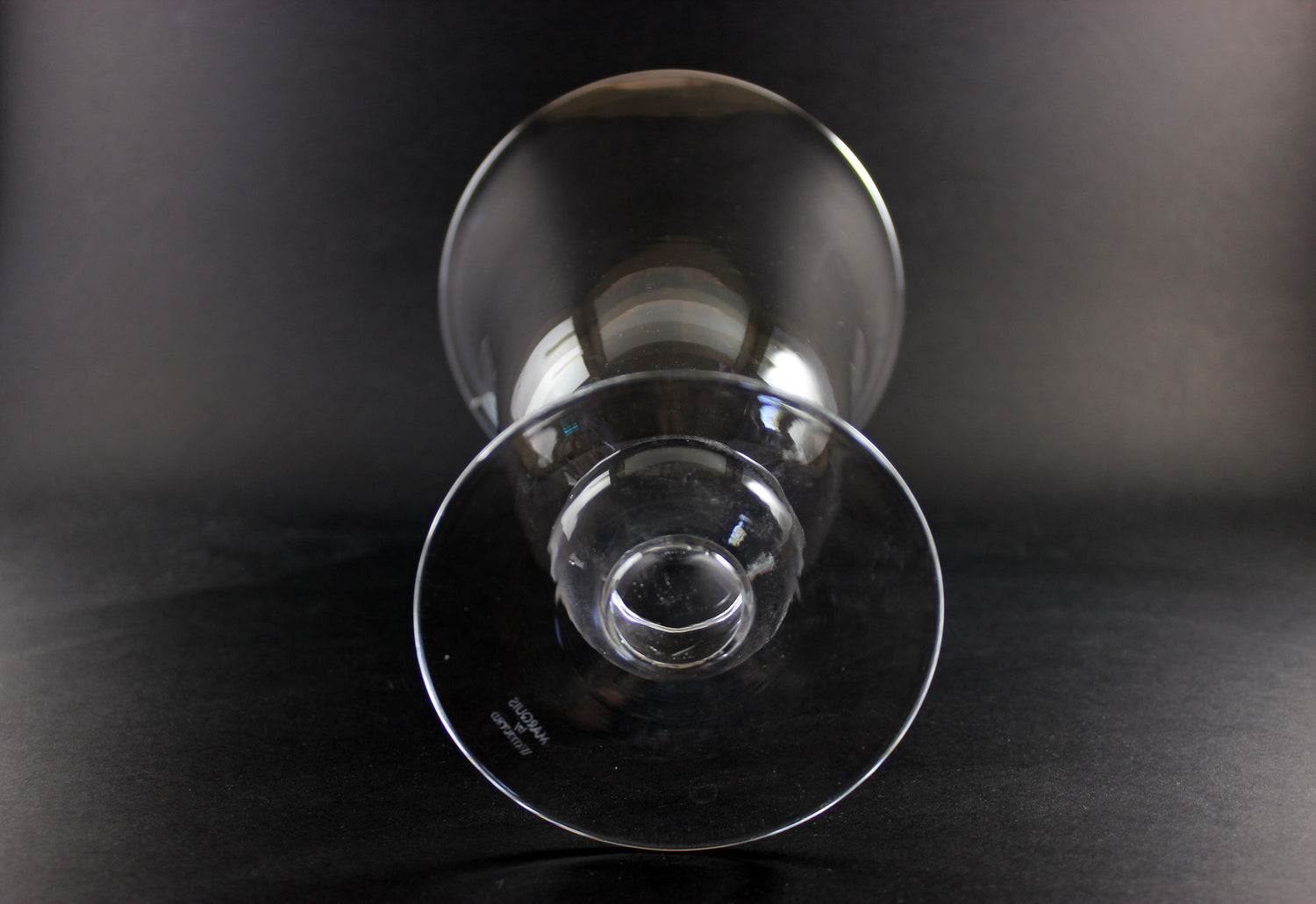 Clear Waterford crystal vase on a black background