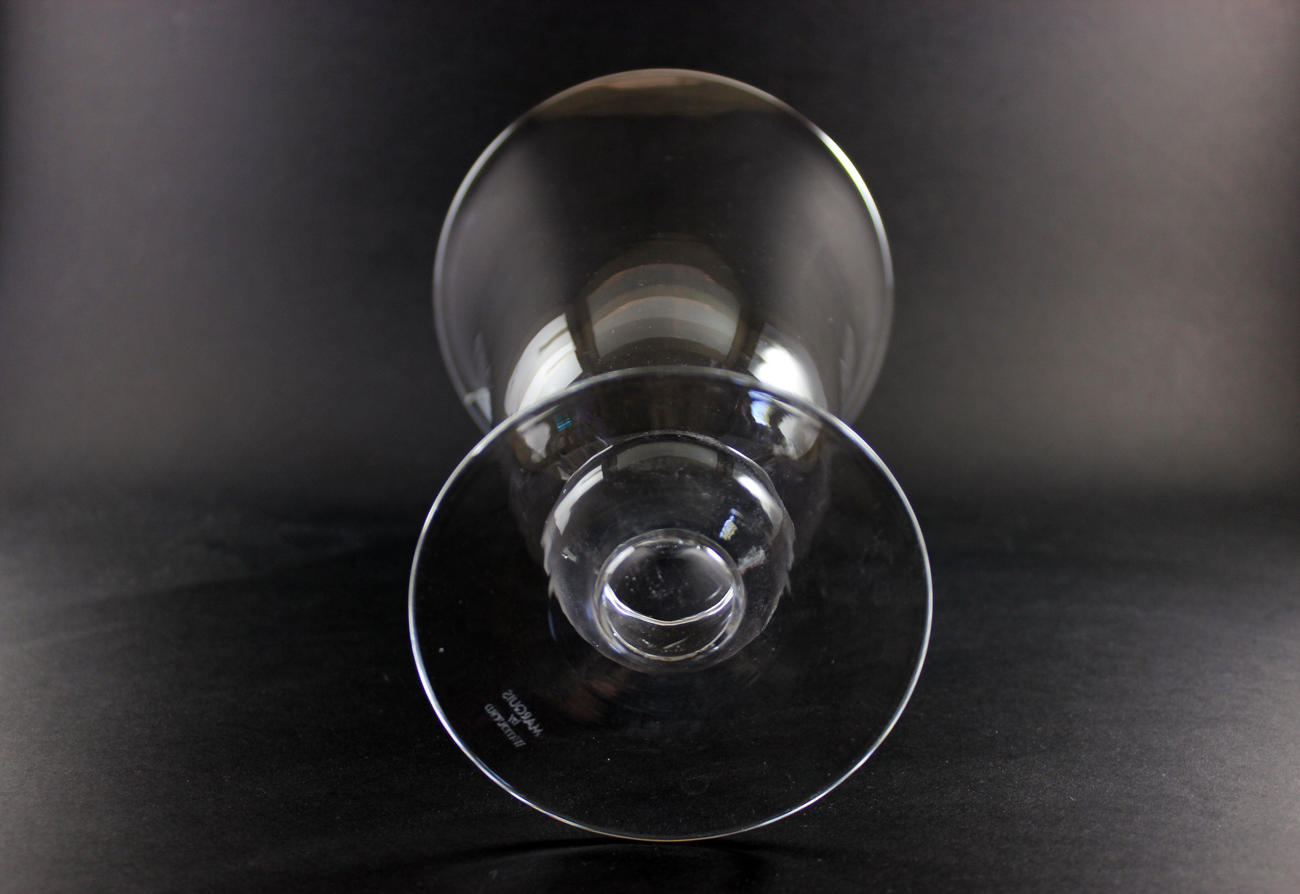 Clear Waterford crystal vase on a black background