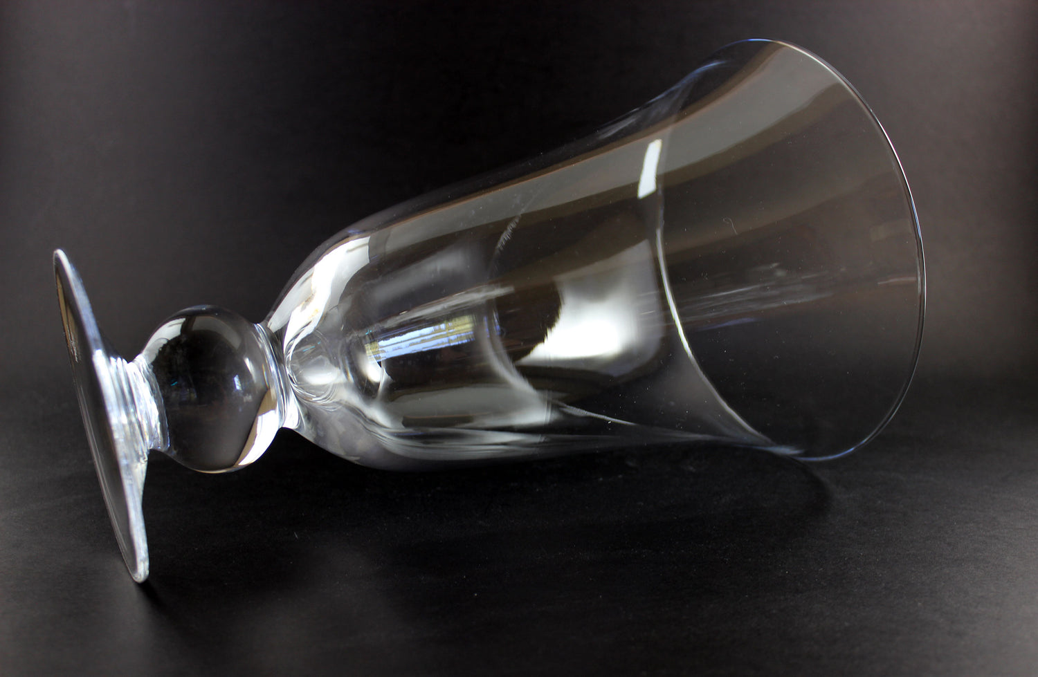 Clear Waterford crystal vase on a black background