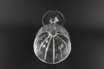 Clear glass object on a black background