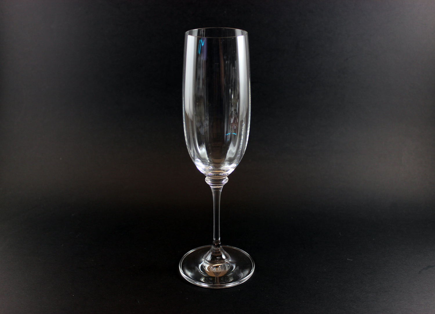 Mikasa Stephanie Pattern clear champagne flute on a black background