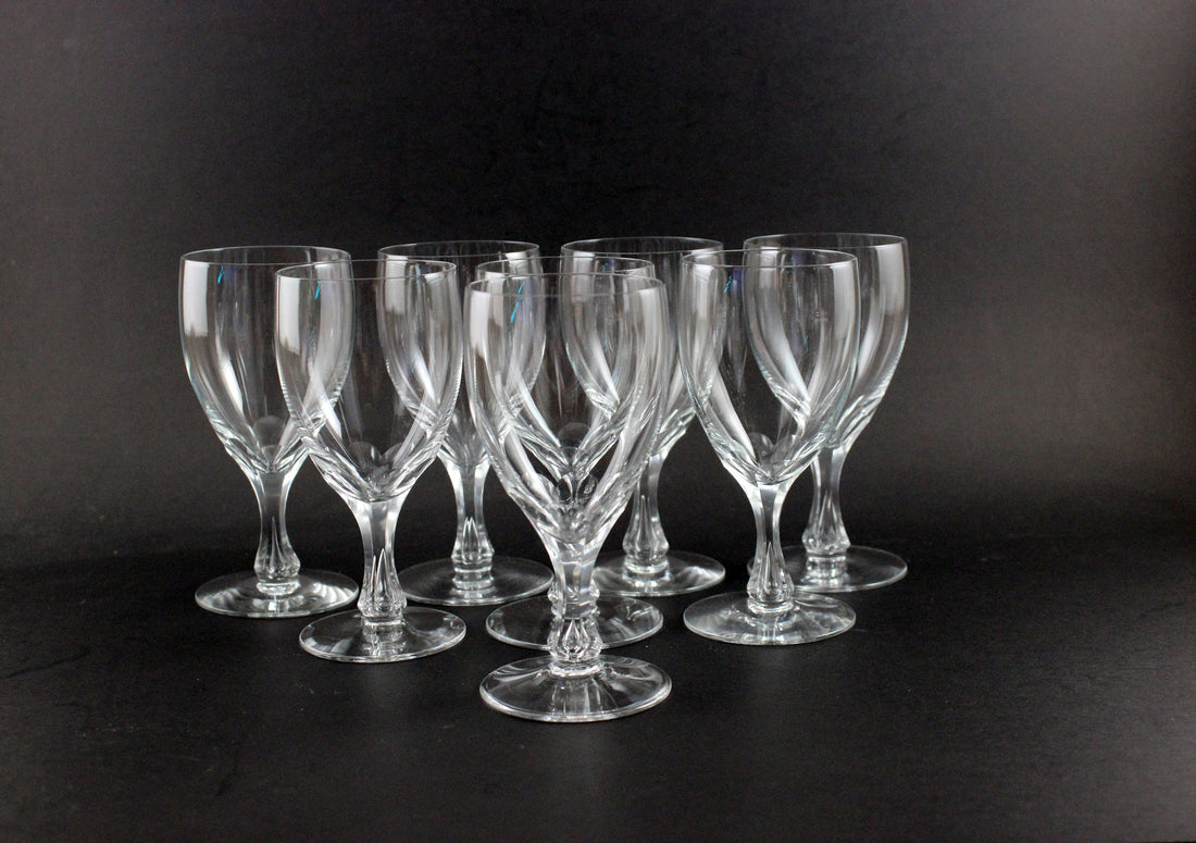 Set of clear wine glasses on a black background